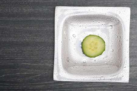 Vegetarian background with fresh green cucumber . Healthy vegetableの写真素材