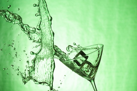 Martiniglass with stream fresh drink. Splashing cocktailの写真素材