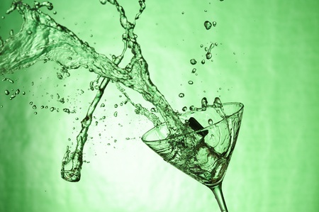 Martiniglass with stream fresh drink. Splashing cocktailの写真素材