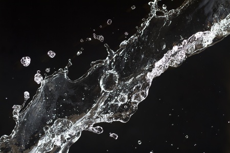 Splashing water. Clear water  on black backgroundの写真素材