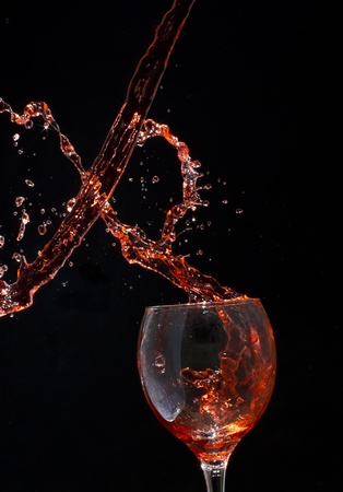 Splashing red wineの写真素材
