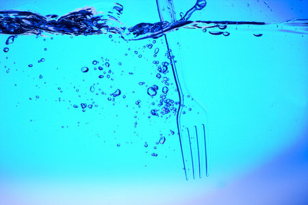 Fork in the blue water