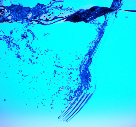 Fork in the blue water