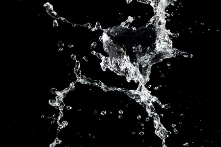 Water splash. Isolated on black backgroundの写真素材