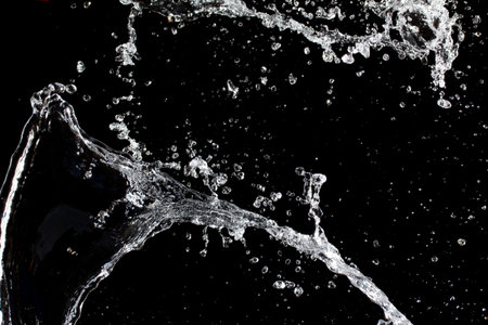 Water splash. Isolated on black background