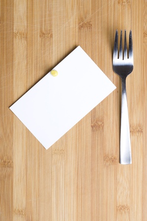 Well used chopping board and fork
の写真素材