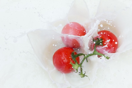 Tomato and splashing milkの写真素材