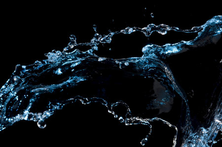 Creativve splashing water isolated on black, Creative splash
