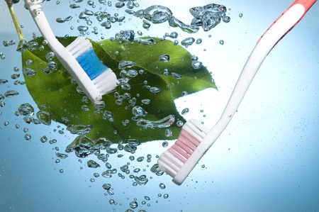 Toothbrush on creative background with blue water bubbles
の写真素材