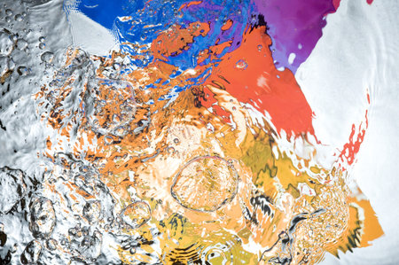 Background with colourful splashing  water. Creative abstract