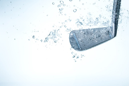 Golf club in blue water. Club and bubbles
の写真素材