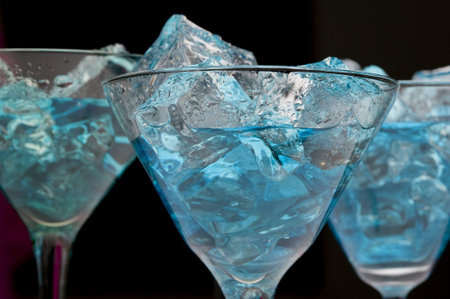 Blue cocktail and ice. Cold  alcoholic drinkの写真素材