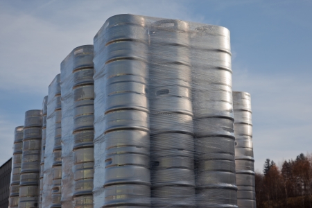 Beer barrels in a stack - preparing to transportationの写真素材