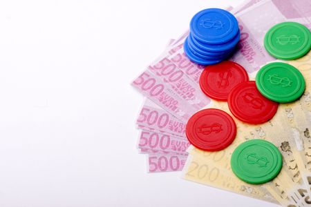Several casino chips on top of one ticketの写真素材