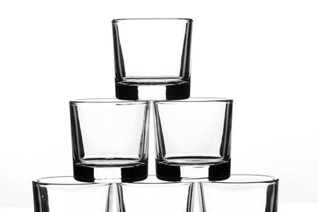 six small glasses placed in a pyramidの写真素材