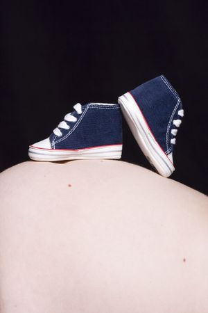 the belly of a breast on her some shoesの写真素材