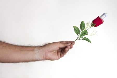a man giving a rose to the woman he lovesの写真素材