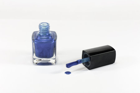 a small bottle of nail polish blueの写真素材