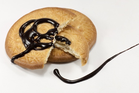 two cookies with chocolate syrup overの写真素材