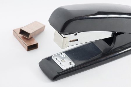 black stapler and some spare clipsの写真素材