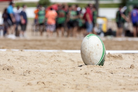 a rugby ball, after a game of beach rugbyの写真素材