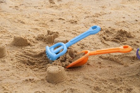 shovel in the sand on the beachの写真素材