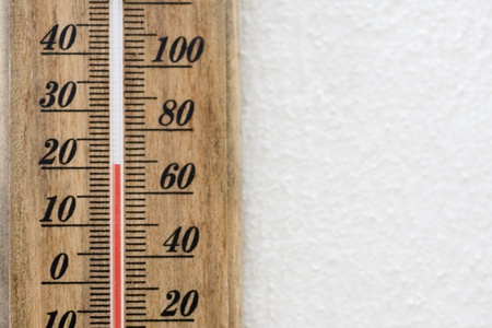 mercury thermometer hung on a wall woodの写真素材