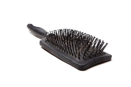 black comb, with remnants of hairの写真素材