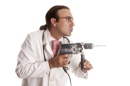 a crazy doctor with a drillの写真素材