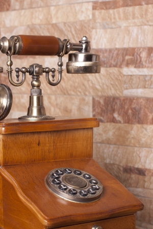 an old telephone, built in wood and metalの写真素材