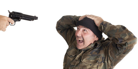 A guerrilla with a gun, shooting