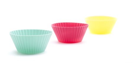 Stack of a variety of colorful cupcake liners in pastel colorsの写真素材