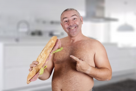 a man eating a huge sandwichの写真素材