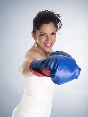 a bride with boxing gloves as a sign of struggleの写真素材
