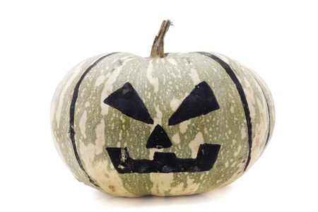 a huge pumpkin with a painted faceの写真素材