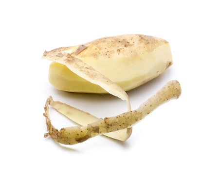 cutting a potato, to prepare it to be cookedの写真素材