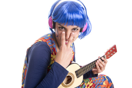 hippy girl with her colorful costume dancingの写真素材