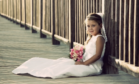 a girl in a wedding dress on the beachの写真素材