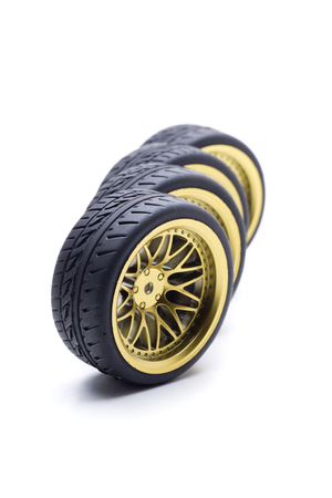 Design wheels in gold color for speed carsの写真素材