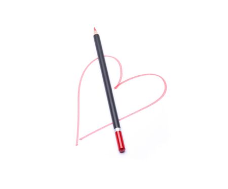 drawing of a red heart, and the pencil with which it has been drawnの写真素材