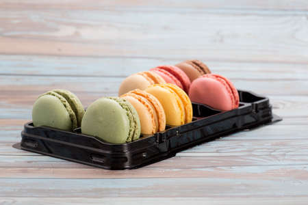 several macaroons of different flavors such as strawberry, mango or pistachioの写真素材