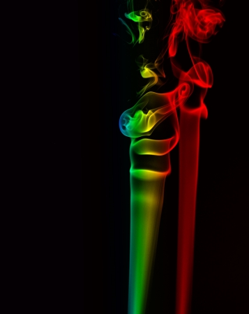 Smoking flames-An abstract shape of smoking flame with coloursの写真素材