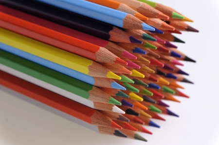 many colored pencils on white backgroundの写真素材