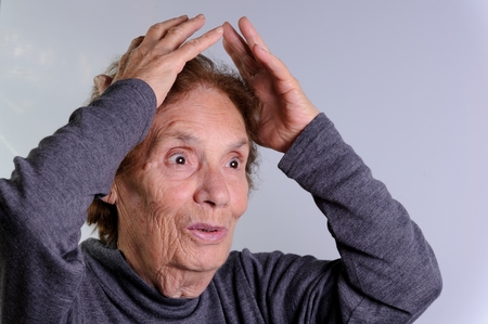 close up of a smiling elderly woman, surprisedの写真素材
