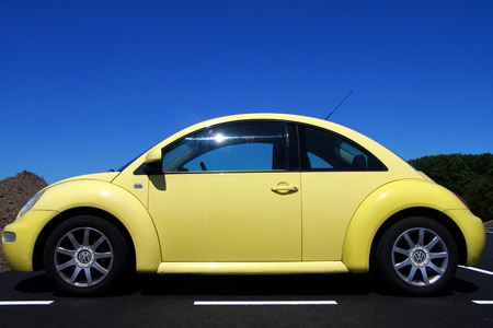 Yellow Volkswagen Beetle sideviewのeditorial素材
