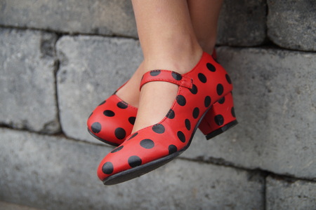 Spanish flamenco dance shoes red crosslegged girlの写真素材