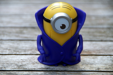 Almere, Flevoland, The Netherlands - July 14, 2015: Vampire Minion McDonalds Happy Meal toy against a wooden backgroundのeditorial素材