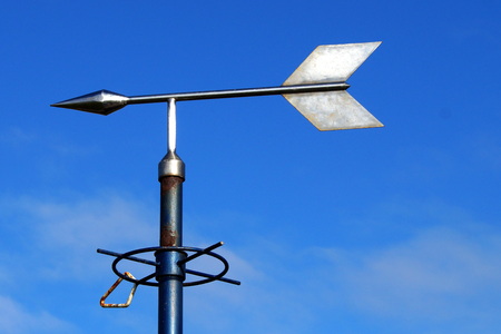 Weathervane against a blue skyの写真素材
