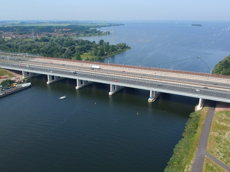 Aerial view of the highway A6 bridge ('' Dutch Bridge '') connecting Dutch provinces of North Holland and Flevoland. In the back is a railroad bridge and the Markermeer.の写真素材