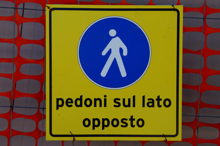 Sign: Pedoni sul lato opposto - Pedestrian on the other side (Italian)